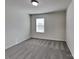 Carpeted bedroom with one window providing ample natural light at 242 Elrosa Rd, Mooresville, NC 28115
