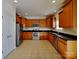 Beautiful kitchen featuring stainless steel appliances, wood cabinets, and tiled floors at 242 Elrosa Rd, Mooresville, NC 28115