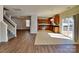 Spacious open-concept kitchen with stainless steel appliances and access to the dining and living areas at 242 Elrosa Rd, Mooresville, NC 28115