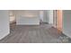 Bright and airy loft area with neutral walls and carpeting, providing versatile living space at 242 Elrosa Rd, Mooresville, NC 28115