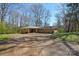 A spacious yard with a great starting point for a new landscape design at 2519 Arnold Dr, Monroe, NC 28110