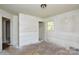 Bedroom featuring a small closet, window, and space awaiting renovation to restore its charm at 2519 Arnold Dr, Monroe, NC 28110