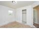 Bright bedroom with a window and closet space ready for renovation to match your unique style at 2519 Arnold Dr, Monroe, NC 28110