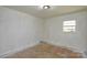 Empty bedroom bathed in natural light from its window, ideal for customization and transformation at 2519 Arnold Dr, Monroe, NC 28110