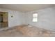 Spacious bedroom with natural light provides ample opportunity for a refresh at 2519 Arnold Dr, Monroe, NC 28110
