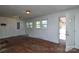 Versatile bonus room with two windows, wood paneling, and ample space at 2519 Arnold Dr, Monroe, NC 28110