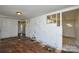 View of a damaged living room needing repair with incomplete walls and exposed flooring at 2519 Arnold Dr, Monroe, NC 28110