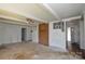 Open living room featuring a brick accent wall, neutral decor, and seamless transitions to other spaces at 2519 Arnold Dr, Monroe, NC 28110