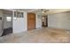 Inviting living room with a brick accent wall, white walls, and an open layout at 2519 Arnold Dr, Monroe, NC 28110