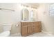 Bright bathroom boasts a double vanity with wood cabinets, white counters, and modern finishes at 2532 Pimpernel Rd, Charlotte, NC 28213