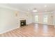 Open-concept living area with hardwood floors, a fireplace, and recessed lighting at 2532 Pimpernel Rd, Charlotte, NC 28213