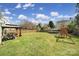 Spacious backyard with lush green grass, a charming gazebo, and a fun playground set at 257 Notable Ln, Rock Hill, SC 29732