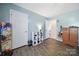 Comfortable bedroom with wood-look flooring, ample closet space, and open doorway at 257 Notable Ln, Rock Hill, SC 29732