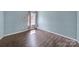 Bedroom features light blue walls, natural light, and light brown wood flooring at 257 Notable Ln, Rock Hill, SC 29732