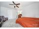 This bedroom features a bed, ceiling fan, and an accent chair near the window at 257 Notable Ln, Rock Hill, SC 29732