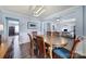 Bright dining area with table, chairs, wainscoting and view to the living room and entry at 257 Notable Ln, Rock Hill, SC 29732