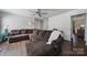 Spacious living room with hardwood floors, a ceiling fan, and a large sectional sofa for ultimate comfort at 257 Notable Ln, Rock Hill, SC 29732
