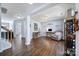 Open-concept living room with hardwood floors, neutral paint, and ample space for relaxation and entertainment at 257 Notable Ln, Rock Hill, SC 29732