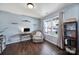 Bright home office with a large window, wood floors, shelving, and comfortable seating at 257 Notable Ln, Rock Hill, SC 29732
