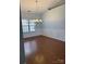Formal dining area with hardwood floors, wainscoting, and a chandelier adding classic elegance at 2608 Glyncastle Way, Gastonia, NC 28056