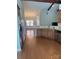 Open concept kitchen flowing into the dining area, featuring stainless steel appliances and ample counter space at 2608 Glyncastle Way, Gastonia, NC 28056