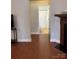 Open-concept space showing a view of the bathroom from the living room area, with a fireplace at 2608 Glyncastle Way, Gastonia, NC 28056