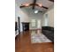 Spacious living room featuring a fireplace, ceiling fan, and vaulted ceilings with wood beams at 2608 Glyncastle Way, Gastonia, NC 28056
