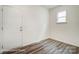 Welcoming entryway with a white front door, wood-look floors, and window at 2783 Ashton Park Ln # 67, Monroe, NC 28110