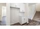 Hallway features white cabinets, a counter, and a stairwell at 2783 Ashton Park Ln # 67, Monroe, NC 28110