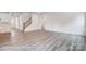 Spacious living room with wood-look flooring, staircase, and bright natural light at 2783 Ashton Park Ln # 67, Monroe, NC 28110