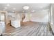 Spacious living room features modern flooring, an open floor plan, and leads to the kitchen and staircase at 2783 Ashton Park Ln # 67, Monroe, NC 28110