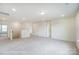 An open and bright loft area with neutral carpet, recessed lights, and staircase at 2783 Ashton Park Ln # 67, Monroe, NC 28110