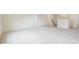 A spacious loft with plush carpeting, white walls, and multiple entry doors at 2783 Ashton Park Ln # 67, Monroe, NC 28110