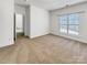 Neutral bedroom with bright window and doorway at 2924 Zion Renaissance Ln, Charlotte, NC 28269