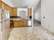 Well-equipped kitchen with stainless steel appliances, ample counter space, and access to an adjoining living area at 2924 Zion Renaissance Ln, Charlotte, NC 28269