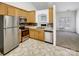 Efficient kitchen featuring stainless steel appliances, wooden cabinetry, and an open layout for easy access at 2924 Zion Renaissance Ln, Charlotte, NC 28269