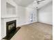 Bright living room with a fireplace and ceiling fan at 2924 Zion Renaissance Ln, Charlotte, NC 28269