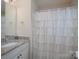 Bathroom featuring a vanity with a granite countertop and a shower with decorative ruffled curtain at 303 Ridge Reserve Dr # 29, Clover, SC 29710
