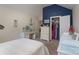 Bedroom featuring coastal decor, built-in vanity and desk, and access to the closet and bathroom at 303 Ridge Reserve Dr # 29, Clover, SC 29710