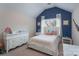 Nautical bedroom with vaulted ceiling, blue accent wall, white dresser, and natural light at 303 Ridge Reserve Dr # 29, Clover, SC 29710
