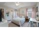 Bright bedroom with a tray ceiling, complemented by light walls, providing a serene retreat at 303 Ridge Reserve Dr # 29, Clover, SC 29710
