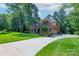 Beautiful two-story brick and stone home featuring an attached garage and well-maintained landscaping at 303 Ridge Reserve Dr # 29, Clover, SC 29710