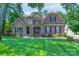 Charming two-story home with a combination of brick and stone exterior and well-manicured lawn at 303 Ridge Reserve Dr # 29, Clover, SC 29710