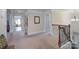 Open hallway featuring a decorative wrought iron banister overlooking the staircase and entry to multiple rooms at 303 Ridge Reserve Dr # 29, Clover, SC 29710