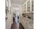 Elegant hallway featuring a built-in hutch with granite countertop and glass-front cabinets at 303 Ridge Reserve Dr # 29, Clover, SC 29710
