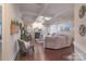 Open-concept living room with hardwood floors, fireplace, and a view into the kitchen at 303 Ridge Reserve Dr # 29, Clover, SC 29710