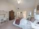 Comfortable main bedroom featuring a desk, ensuite bathroom, and neutral carpeting at 303 Ridge Reserve Dr # 29, Clover, SC 29710
