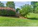 Stone entrance sign for Heron Cove neighborhood with lush landscaping and mature trees at 303 Ridge Reserve Dr # 29, Clover, SC 29710