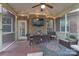 Relaxing screened porch featuring a dining area, comfortable seating, and outdoor entertainment at 303 Ridge Reserve Dr # 29, Clover, SC 29710