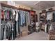 Organized walk-in closet with ample storage, shelving, and hanging space for clothes and accessories at 303 Ridge Reserve Dr # 29, Clover, SC 29710